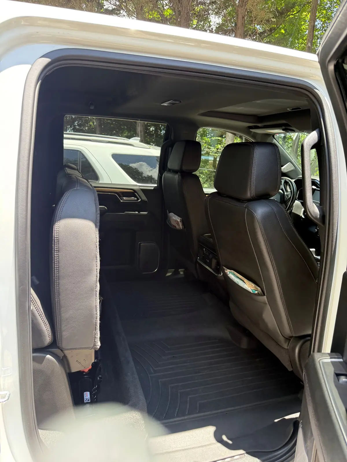 Cleaned rear cabin of a white pickup after interior detailing
